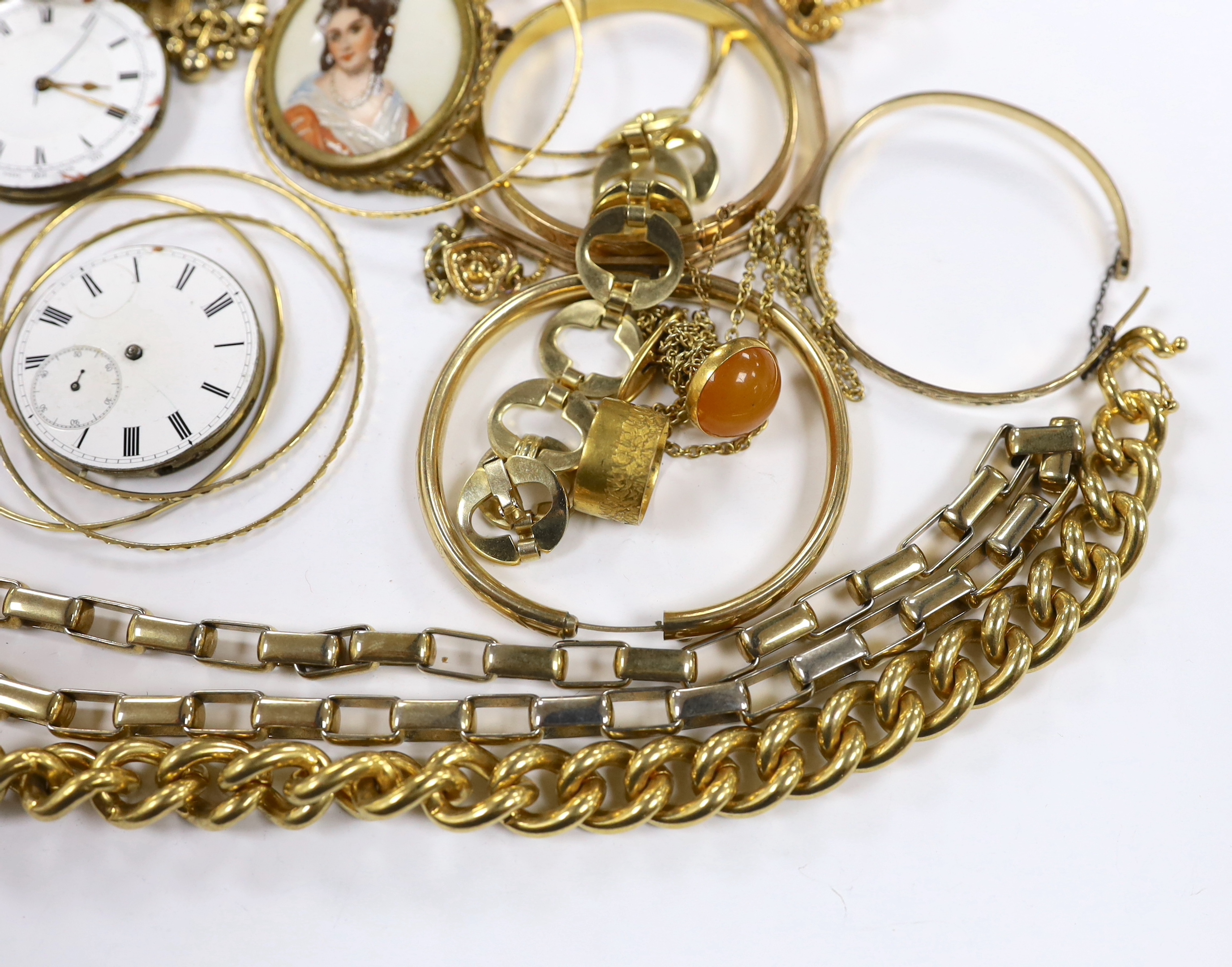 A small quantity of assorted gilt metal or gold plated jewellery, including large cub link necklace, bangles, bracelets, rings, cufflinks etc and three pocket watch movements.